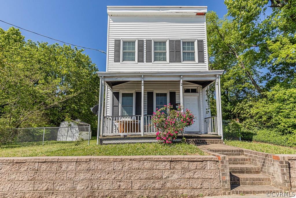 Hardwood floors and exposed brick ratchet up the charm-factor on this two-story, two-bedroom home so