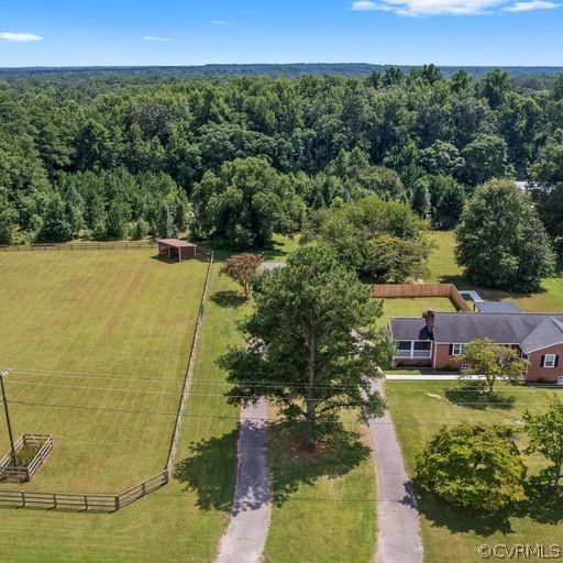 Chesterfield - 34 acres and horse ready! Perfect retreat for someone with a few horses and outdoor lover.  Fenced paddock and run in shed plus huge shed that can be used as a tack room.  Or, take to the wooded area and have fun 4 wheeling the trails -just a stone's throw to the Appomattox and Lake Chesdin.   Classic brick ranch with 5 bedrooms and 3 full baths is fully updated AND has a full finished basement with kitchenette, separate laundry room and private entrance plus rear patio area. Level one has gorgeous hardwood floors and basement has beautiful LVP flooring. Solid brick on block construction, new windows, freshly painted, new flooring, HVAC 2 years young! AMAZING setup - The possibilities are limitless! Main level and basement levels have separate electric meters and each are fully equipped for independent living.  Perfect for Multi generational family!  Seller will also consider selling the home with only a few acres.
