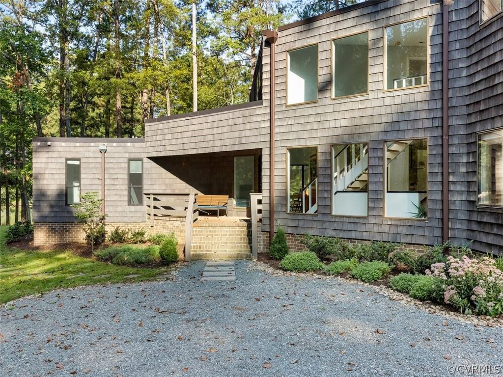Contemporary WATERFRONT home, uniquely situated on a cul-de-sac in the highly sought after Sleepy Ho