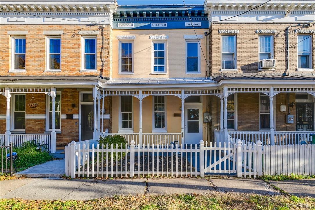 Discover the charm of Historic Jackson Ward with this delightful three-bedroom brick home. Tucked aw