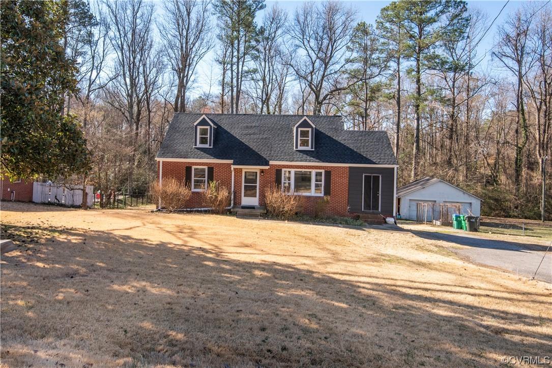 So much house and so much land, you’ll never want to leave! Brick Cape Cod with a full, finished bas