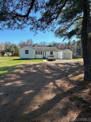 This vinyl sided rancher is situated on 1.25 +/- acres of level land, perfect for a garden. The home