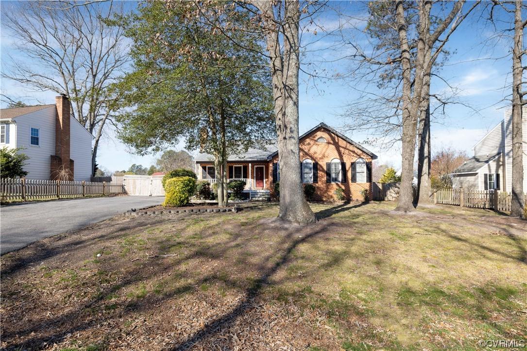 Adorable brick and vinyl rancher with large front porch! Inside you will be greeted with a tiled foy