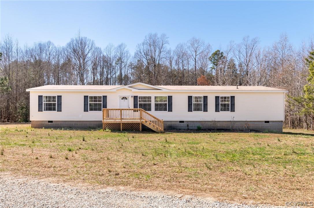Located on 10 acres of land, this spacious one-level, open concept home is perfect for a growing fam
