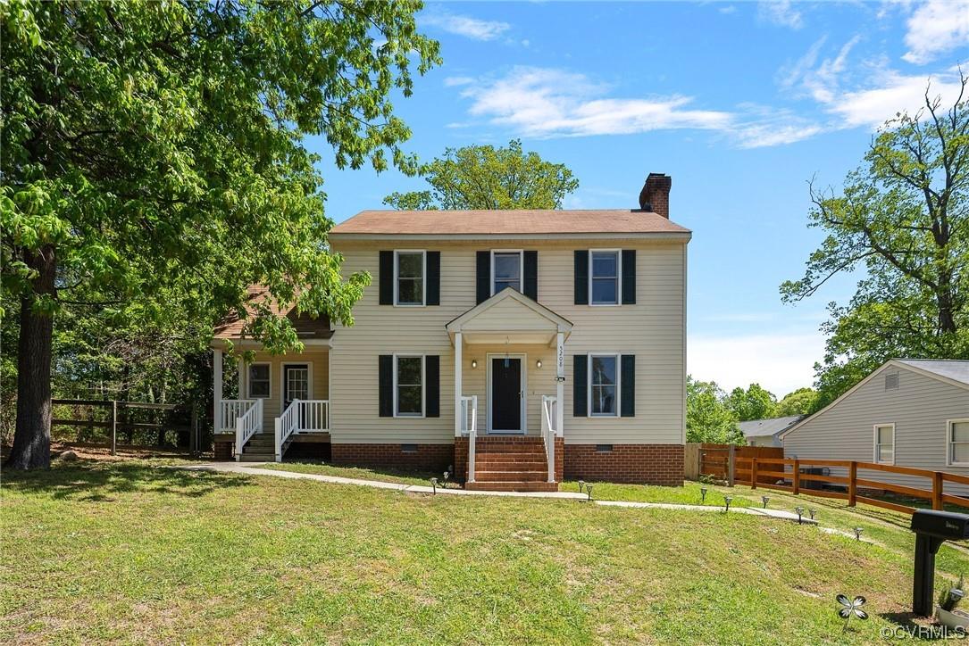 Natural light heaven! A Colonial Style home in West Henrico has a lot of parking space directly in f