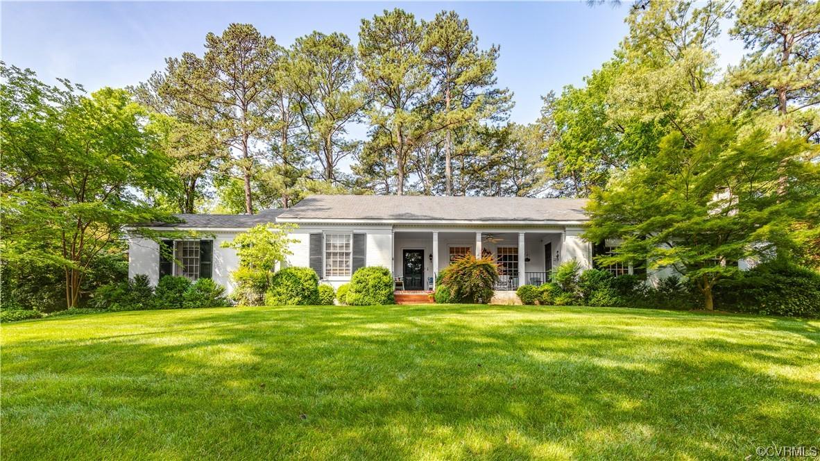 Welcome to this classic white brick ranch, close to local schools, and sited on a sloped lot surroun