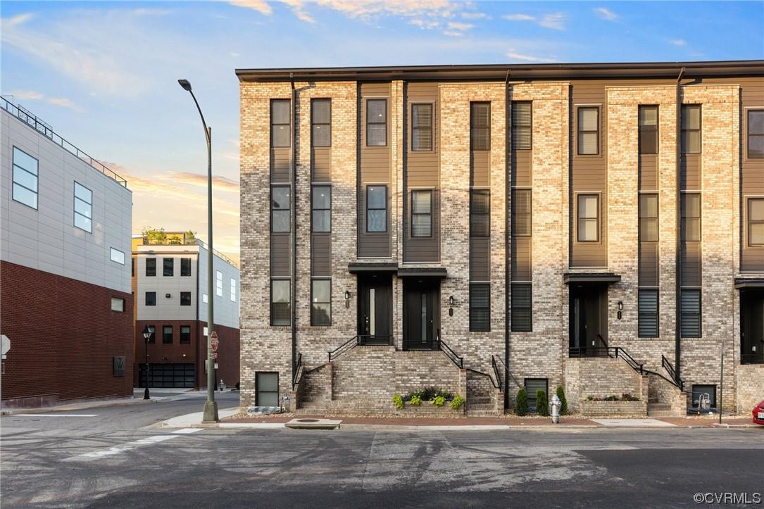 LOCATION LOCATION LOCATION! This 4 level townhome built in 2021 is LIKE NEW and features panoramic v