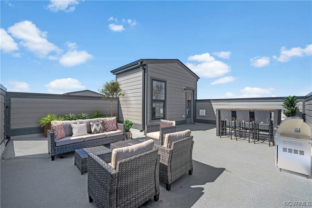 One of our last rooftop terrace homes available at Carver Square with 2 parking spaces. The home fea