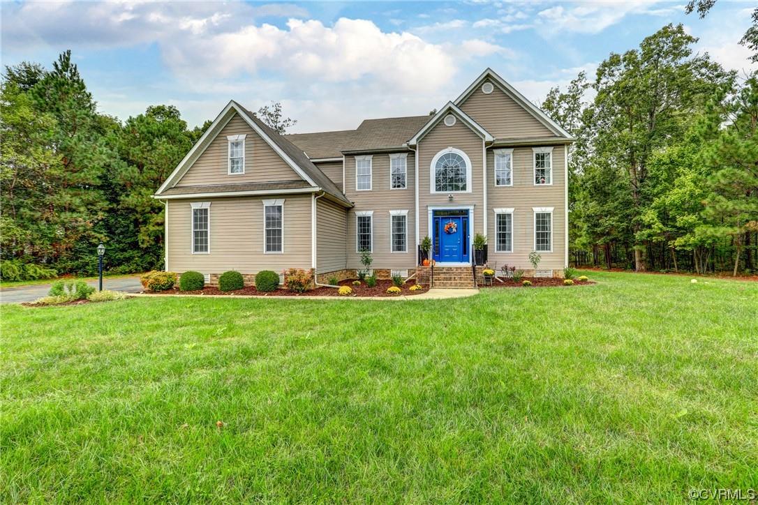 Shows like a dream!  Walk in to a bright 2 story foyer open to formal living and dining room, 2 stor